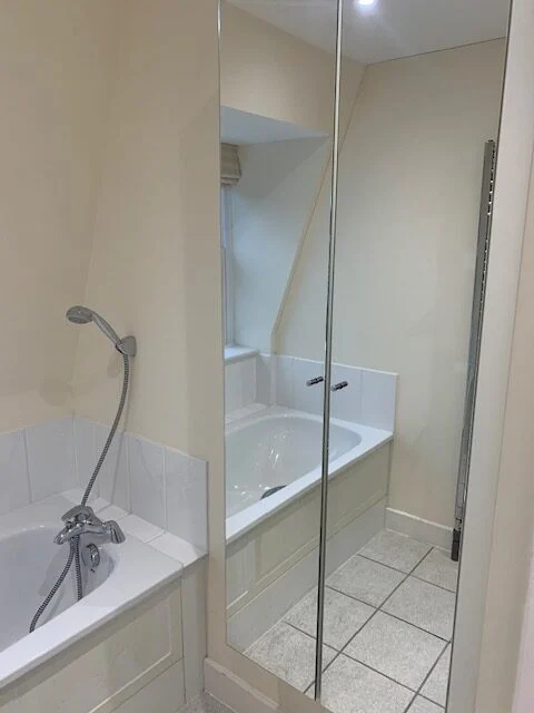Pristine bathroom with bathtub, showcasing Spotclean Ltd's cleaning services in Barking.